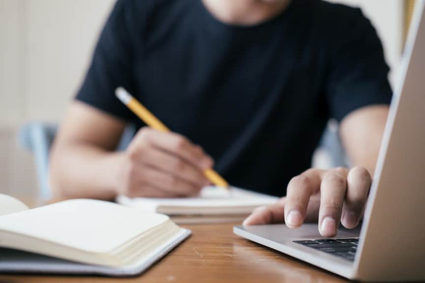 Student using laptop for online cyber school